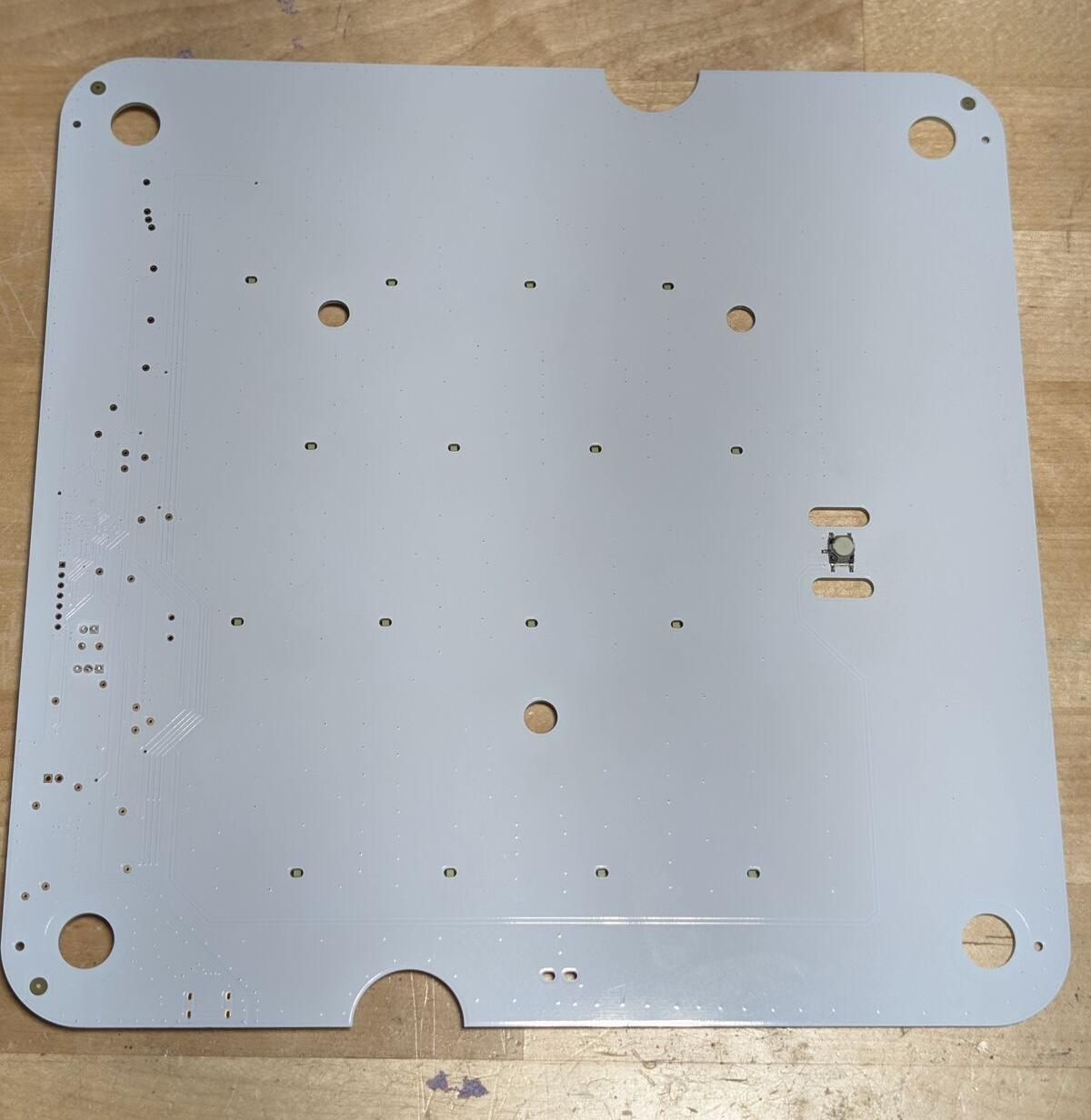 Control board PCB front. Go button and shine-through holes for the status LEDs.