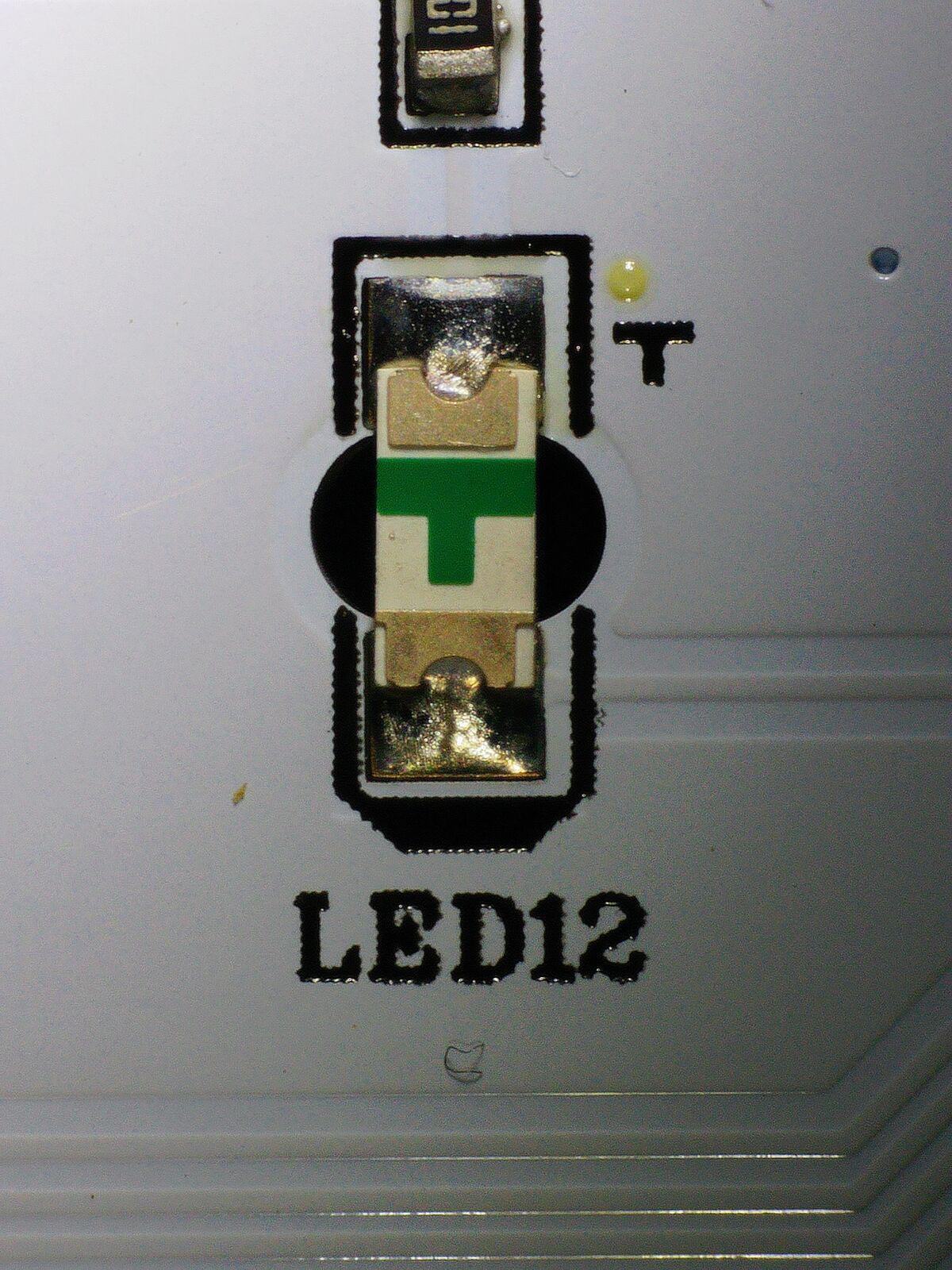 One of the shine-through SMD LEDs (LED12) that indicates tile status from beneath the board.
