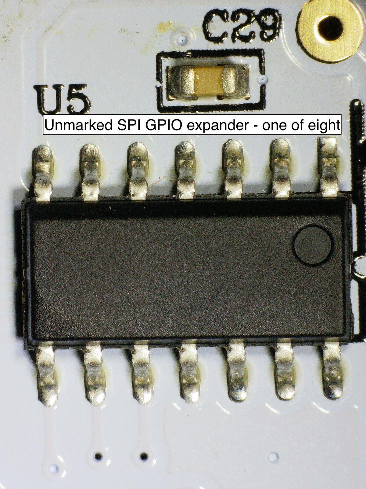 One of eight identical unmarked 14-pin ICs. Each handles two tiles over a shared 3-wire bus.