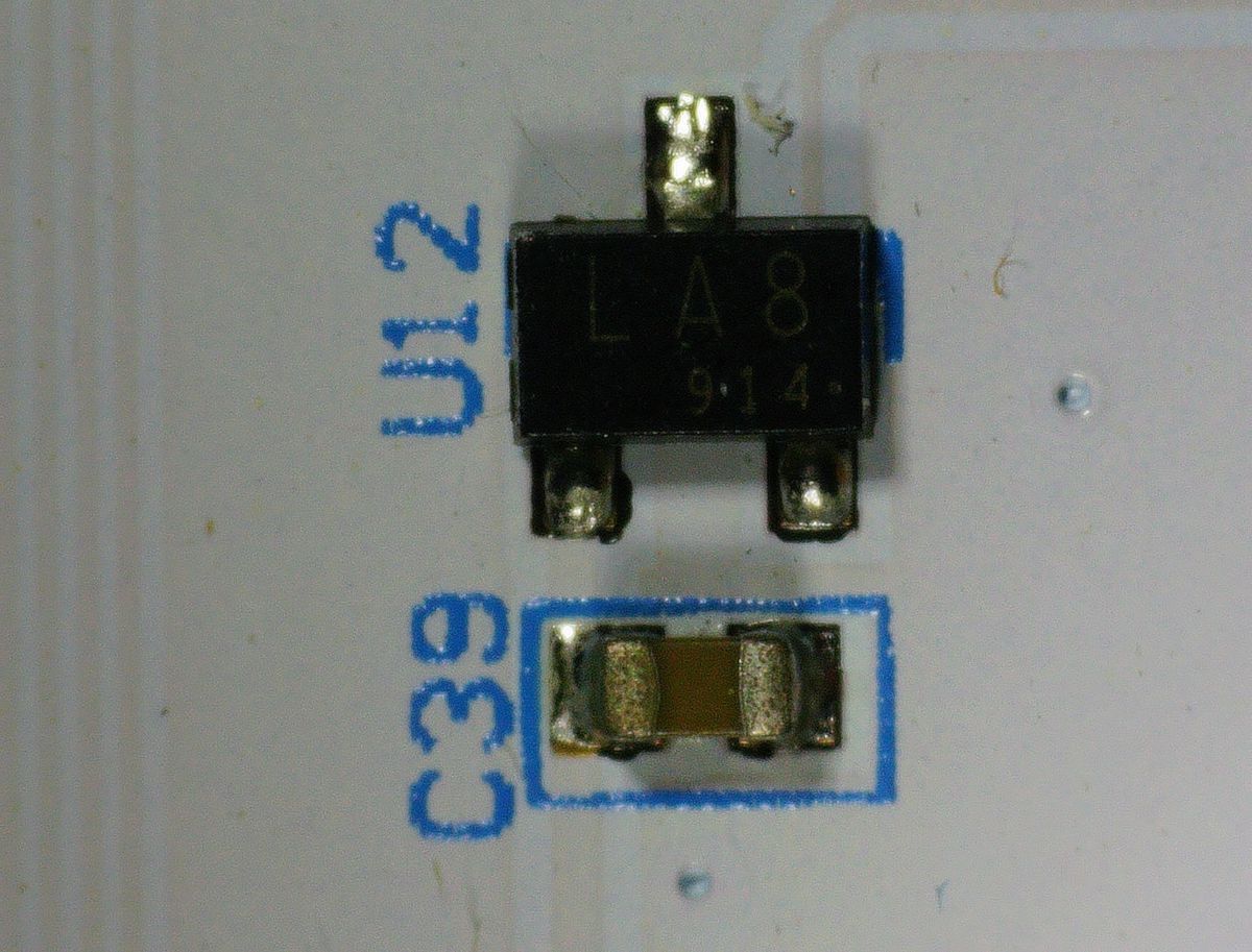 LA8 914 hall effect sensor in SOT-23 package. Three per tile slot. Not reed switches — hall effect.
